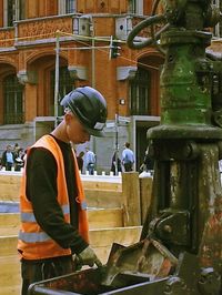 Full length of man standing in city