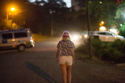 Woman standing at night