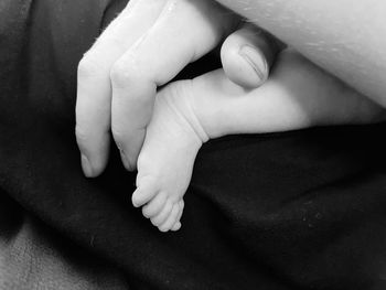 Close-up of hands and baby