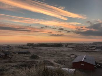 Scenic view of beach against sky during sunset