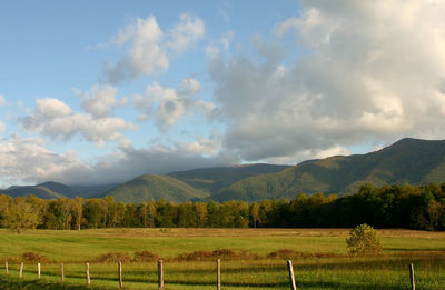 Scenic view of landscape against cloudy sky