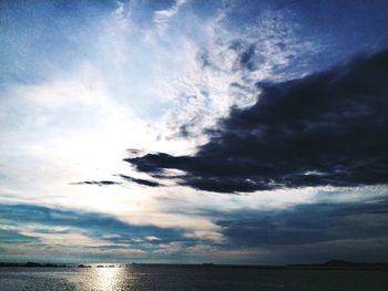 Scenic view of sea against cloudy sky