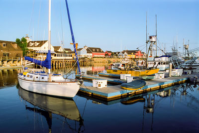 Boats moored at harbor