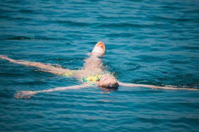 Person swimming in sea