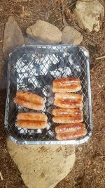 High angle view of meat on barbecue grill