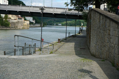 Bridge over river by buildings