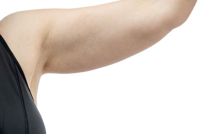 Low section of woman standing on white background