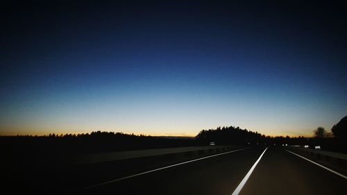 Empty road along landscape