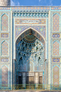 Colorful blue and turquoise traditional mosaic decorating the mosque. oriental ornament 