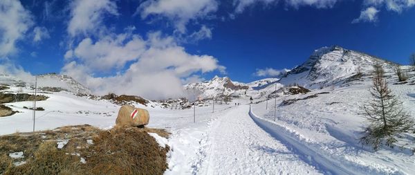 Scenic view of snowcapped mountains against sky