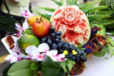 Close-up of pink and fruits on plant