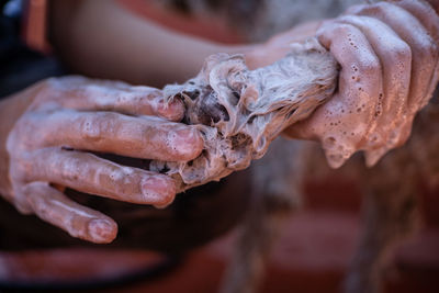 Close-up of hand holding ice cream