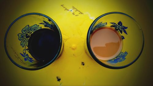 High angle view of yellow juice on table