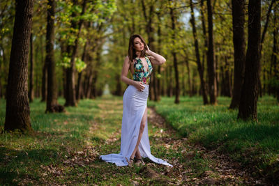 Woman standing in forest