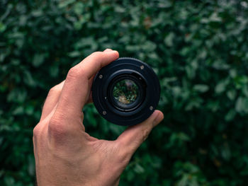 Close-up of hand holding camera