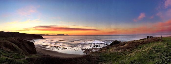 Scenic view of sea at sunset