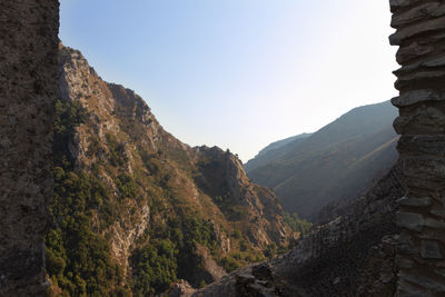 Scenic view of rocky mountains against clear sky