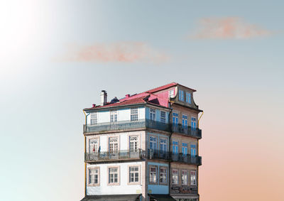 Low angle view of building against sky during sunset