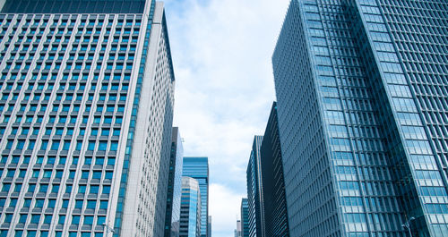 Low angle view of skyscrapers against sky