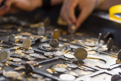 Close-up of hand holding coins