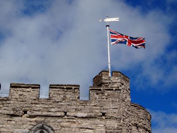 Low angle view of flag against sky