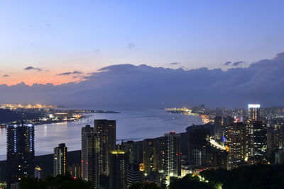 Aerial view of city lit up at night