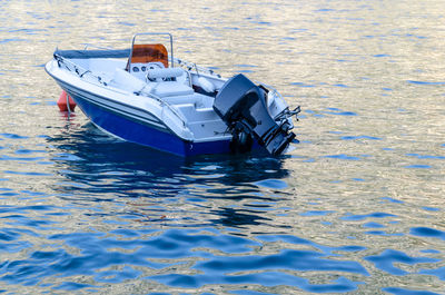 Speedboat on a sea water moored at the buoy