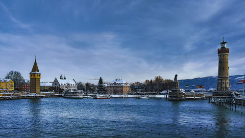 River amidst buildings against sky in city