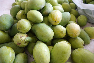 High angle view of mangoes for sale in market
