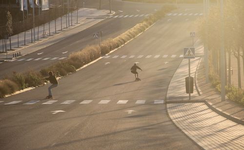 People skating on road