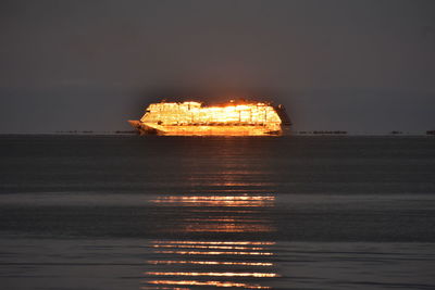 Scenic view of sea against sky at night