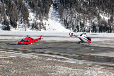 Helicopters on runway during winter