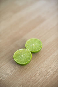 Close-up of green fruit on table