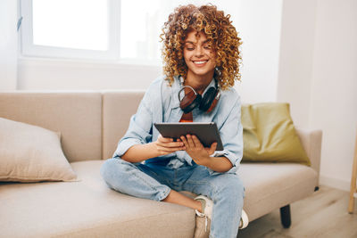 Young woman using laptop at home