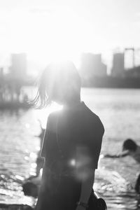 Rear view of woman looking at sea