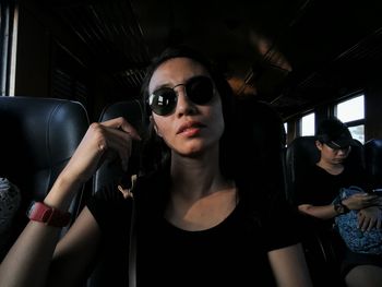 Young woman sitting in bus