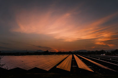 High angle view of railroad tracks against sky during sunset