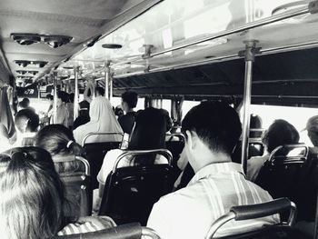 Rear view of people in bus