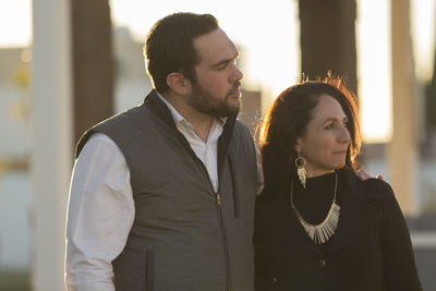 Young couple looking at camera