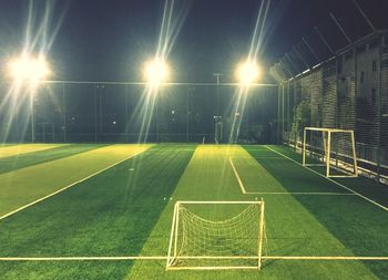 View of soccer field against sky at night