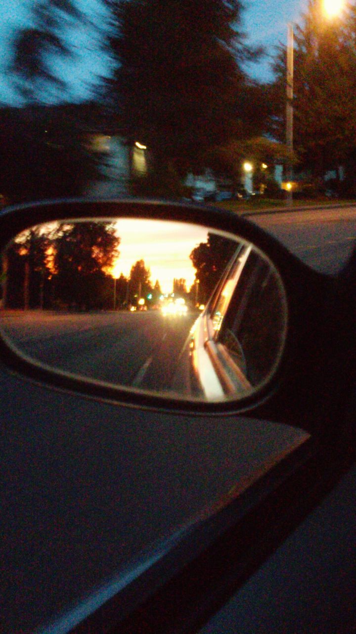 transportation, car, land vehicle, mode of transport, road, side-view mirror, car interior, street, sunset, reflection, vehicle interior, illuminated, windshield, glass - material, on the move, travel, transparent, lens flare, sky, headlight