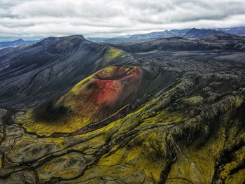 Aerial view of volcanic landscape against sky