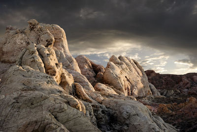 Low angle view of rock formation against sky
