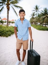 Portrait of young man standing in park