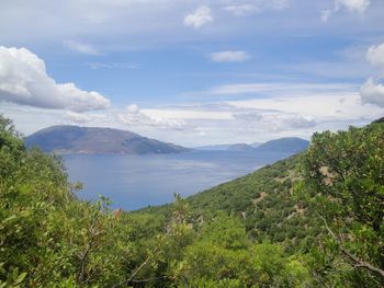 Scenic view of mountains against cloudy sky