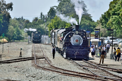 Train on railroad track against sky