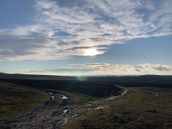 Road by land against sky