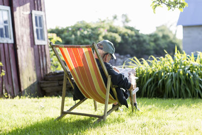Man sitting on sun chair, oland, sweden
