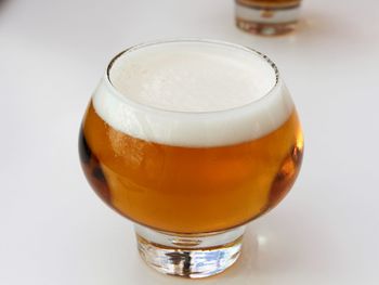 Close-up of beer glass on table