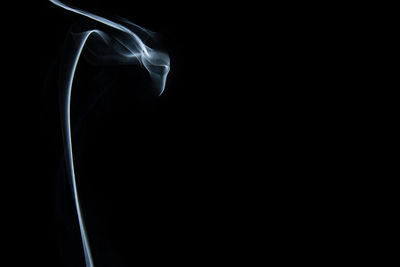 Close-up of smoke against black background